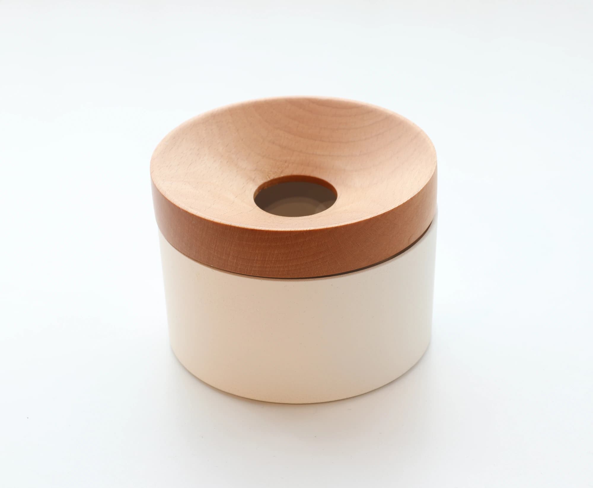 Mordeco Revov Coin Storage Box, cream cylindrical body with magnetic wooden rotating lid and center coin slot, minimalist desk organizer