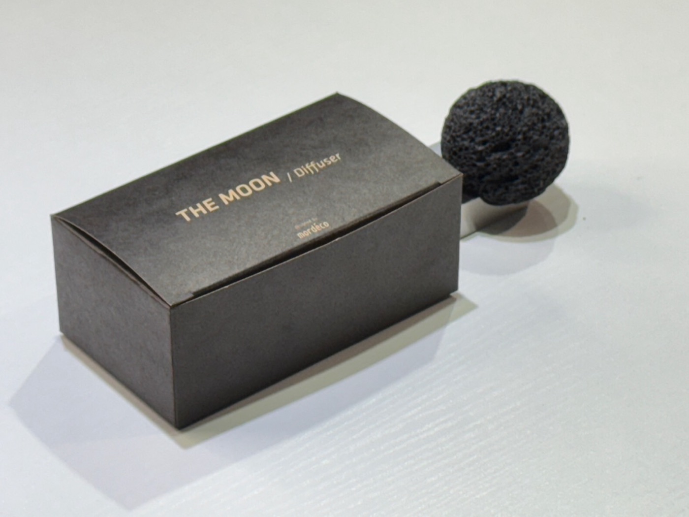 Moon Rock diffuser next to its gift box packaging